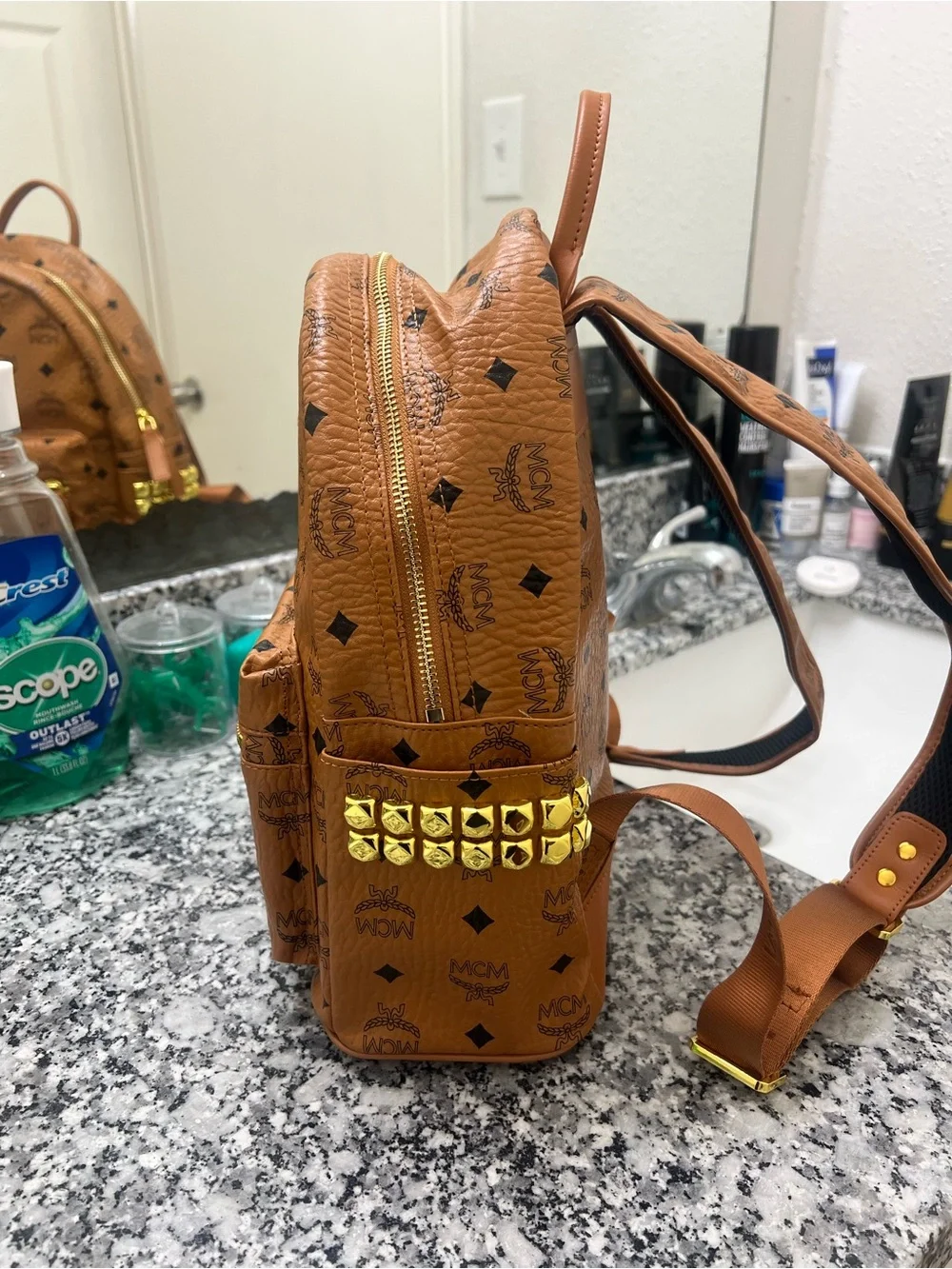 MCM Cognac Monogrammed Leather Mini Backpack with Gold Plaque